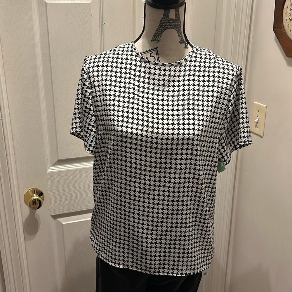 Designed by Hana Sung this top is a winner paired with a Black Jacket !